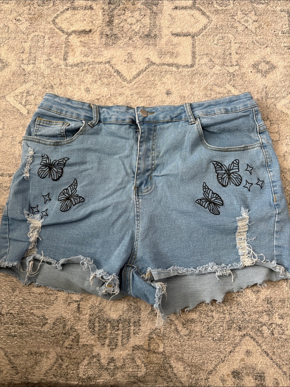 SHEIN Light Blue Distressed Denim Shorts with Butterfly Print